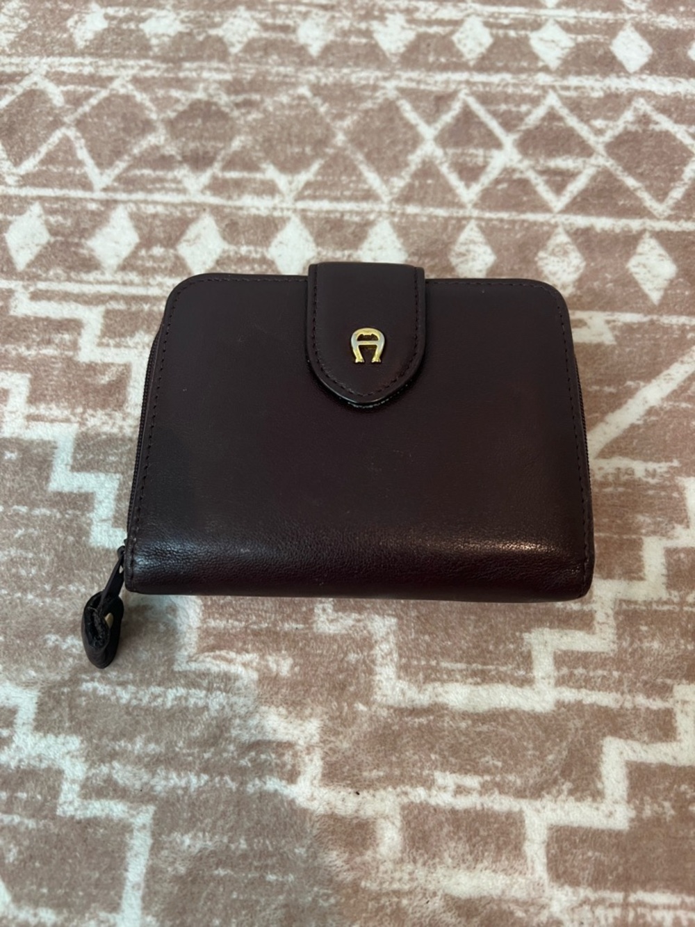 Etienne Aigner dark brown/mahogany bi-fold leather wallet w/ gold horseshoe logo